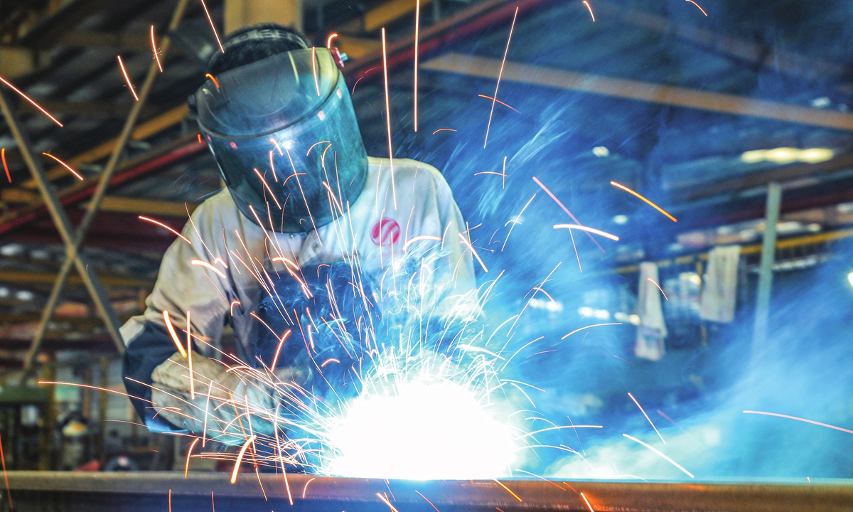 A worker makes elevator parts that will be sent overseas in a factory in Nanxun district of Huzhou, East China's Zhejiang Province on July 18, 2023. As one of the country's three major elevator industry clusters, Nanxun's elevator production accounted for 10 percent of the country's total, with annual output value of more than 10 billion yuan ($1.39 billion). Photo:VCG